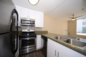 Indie Westside kitchen with appliances